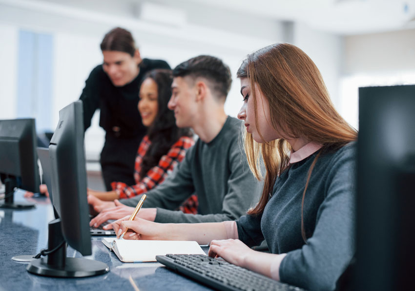 event image:Group of students using computers.